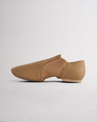 Side view of latte jazz dance shoe showing slip-on style, flexible neoprene arch, and low-profile split-sole construction.