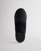 Sole view of black adult jazz shoe showing anti-slip split sole and textured grip panels.