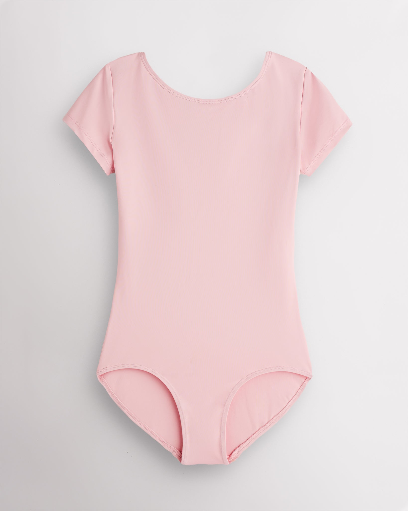 Ballet Pink short sleeve leotard for women with round neckline, fitted silhouette, and built-in shelf bra lining.