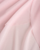 Close-up of pink dance skirt showing soft mesh fabric and graceful drape