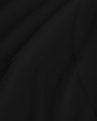 Close-up of black dance skirt showing soft mesh fabric and graceful drape