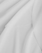 Close-up of white dance skirt showing soft mesh fabric and graceful drape