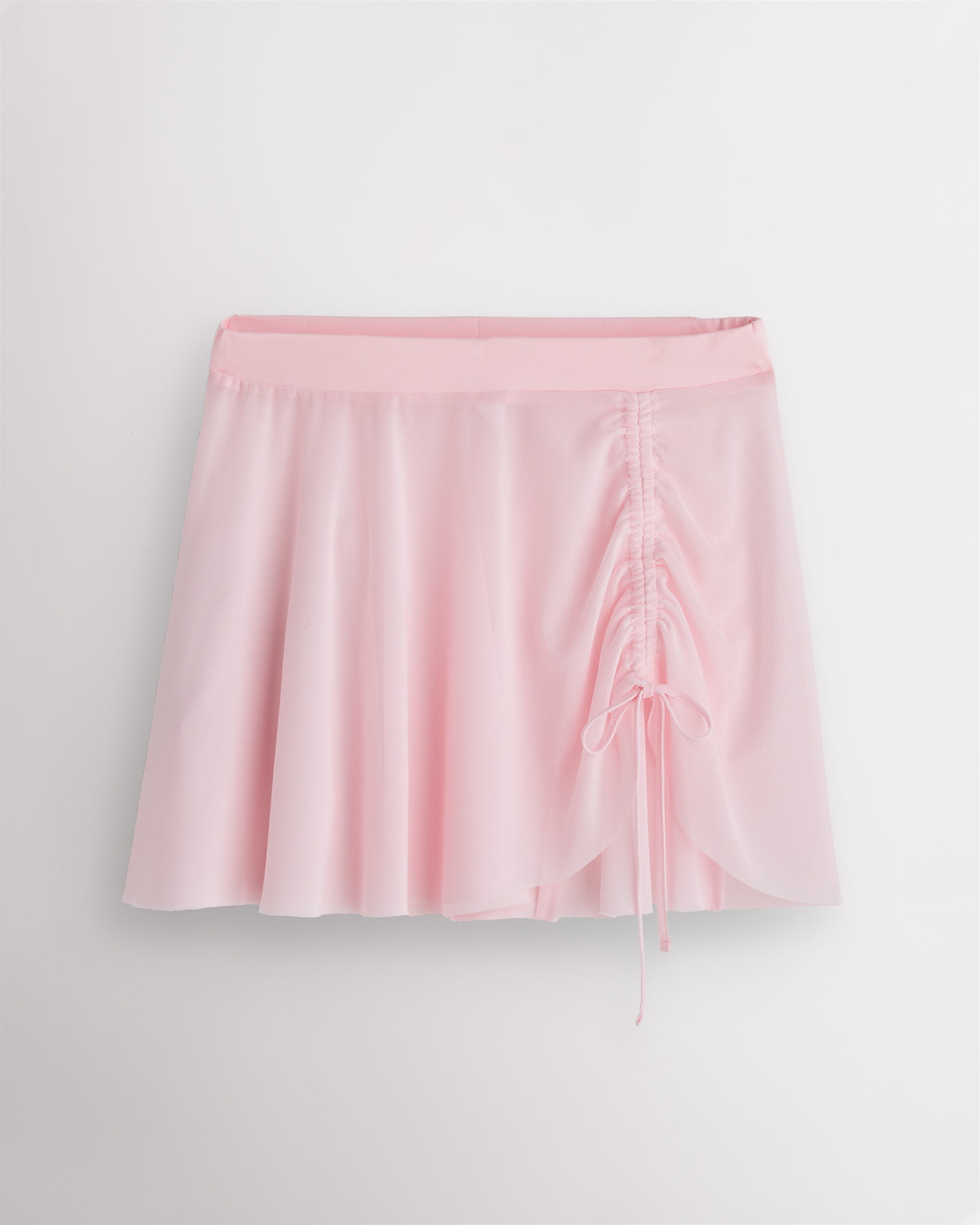 Ballet pink Stelle womens adjustable ruched mesh ballet skirt with asymmetrical drawstring detail.