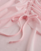 Close-up of ballet pink mesh ballet skirt showing adjustable ruched drawstring and soft sheer fabric.
