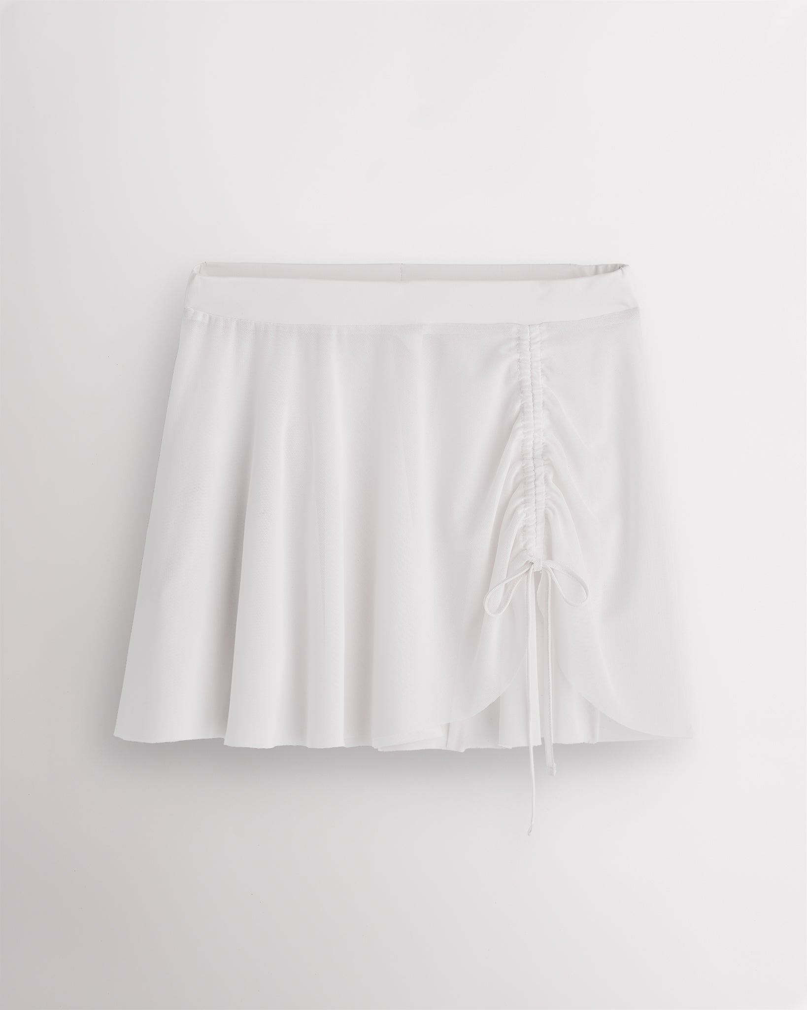 White Stelle womens adjustable ruched mesh ballet skirt with asymmetrical drawstring detail.