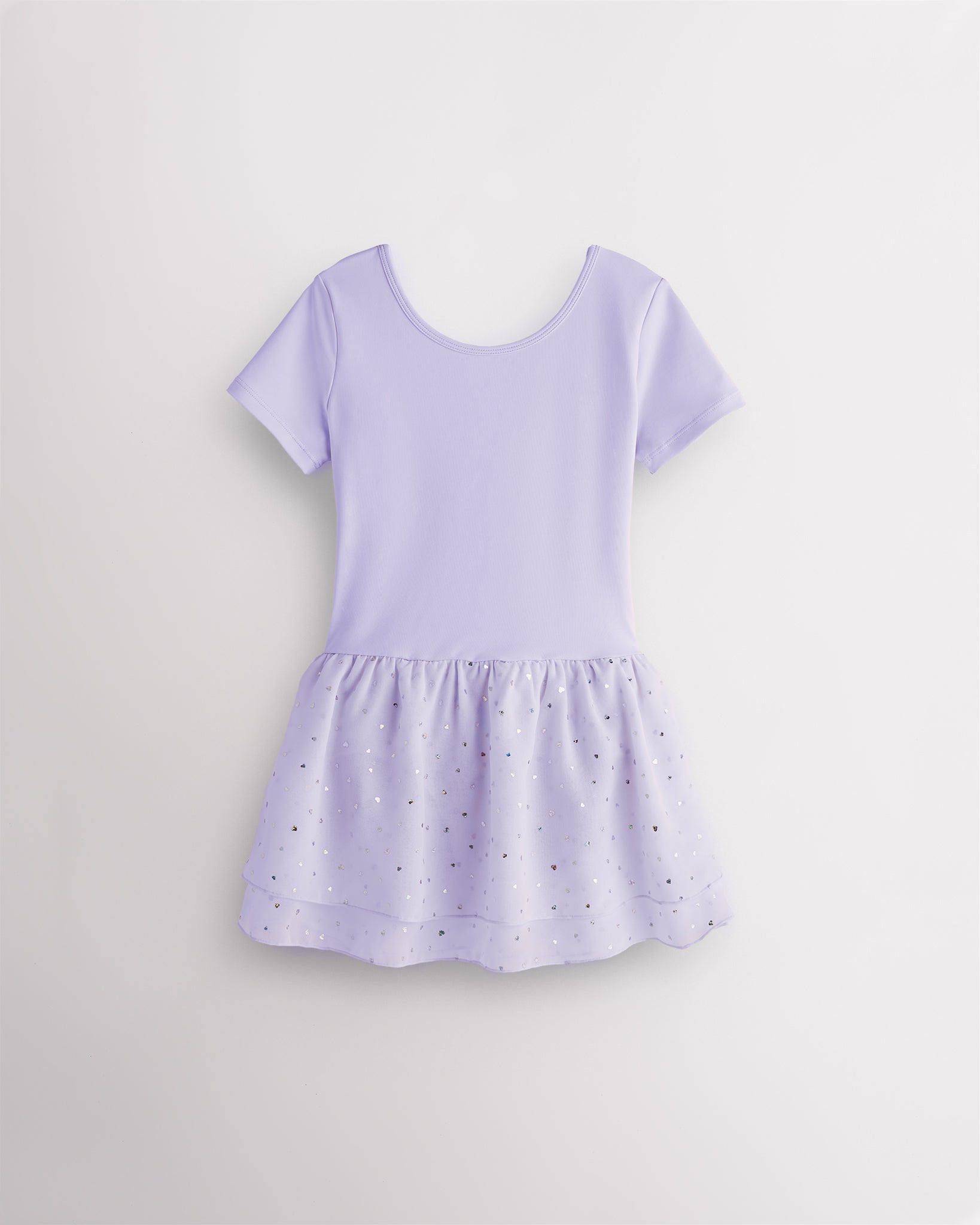 
                    Lavender girls ballet dress with short sleeves, crewneck, fitted bodice, and chiffon skirt with heart-shaped sequins.
                  