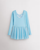 Back view of blue girls ballet dress laid flat showing the crisscross back, long sleeves, and attached chiffon wrap skirt.