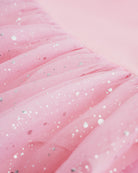 Close-up of Ballet Pink mesh skirt showing soft layered fabric and subtle shimmer details.