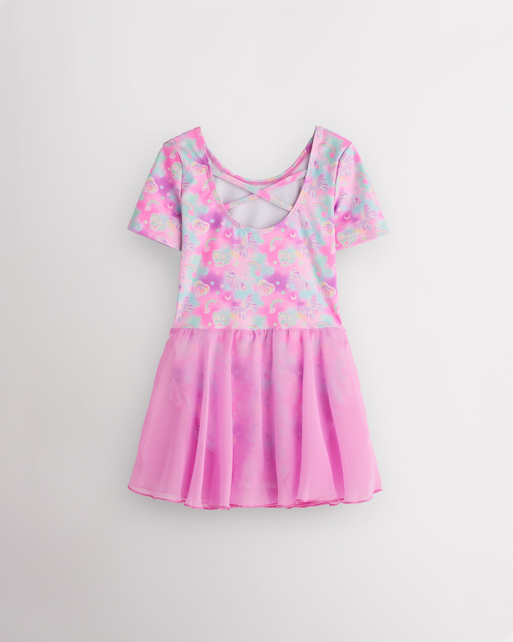 Back view of Bow Dreams dance ballet dress with short sleeves, crisscross back detail, shimmering print, and attached skirt.