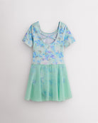 Back view of Butterfly Mist dance ballet dress with short sleeves, crisscross back detail, shimmering print, and attached skirt.
