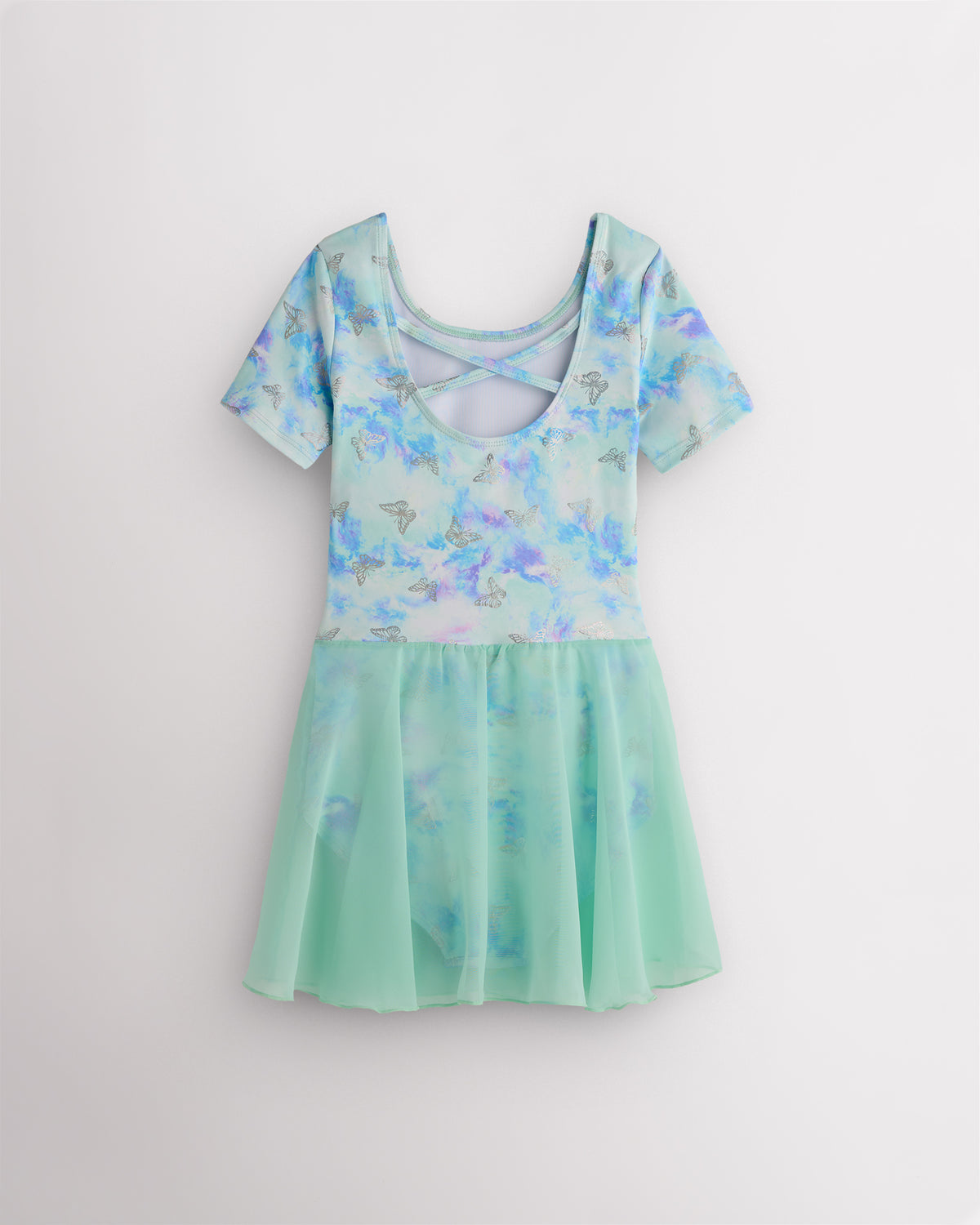 Back view of Butterfly Mist dance ballet dress with short sleeves, crisscross back detail, shimmering print, and attached skirt.