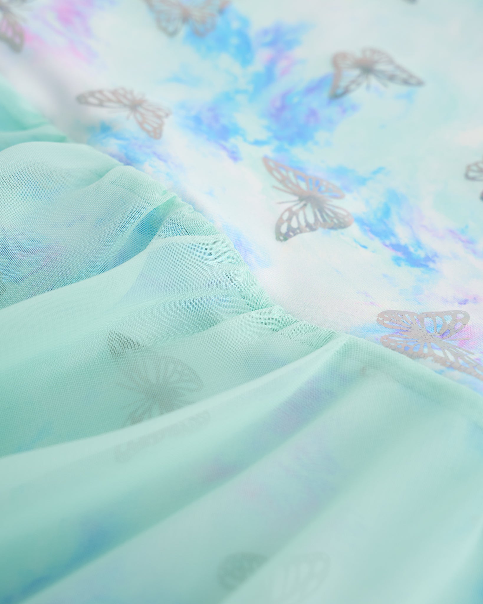 Close-up of Butterfly Mist ballerina ballet dress showing the shimmering print and lightweight layered skirt fabric.