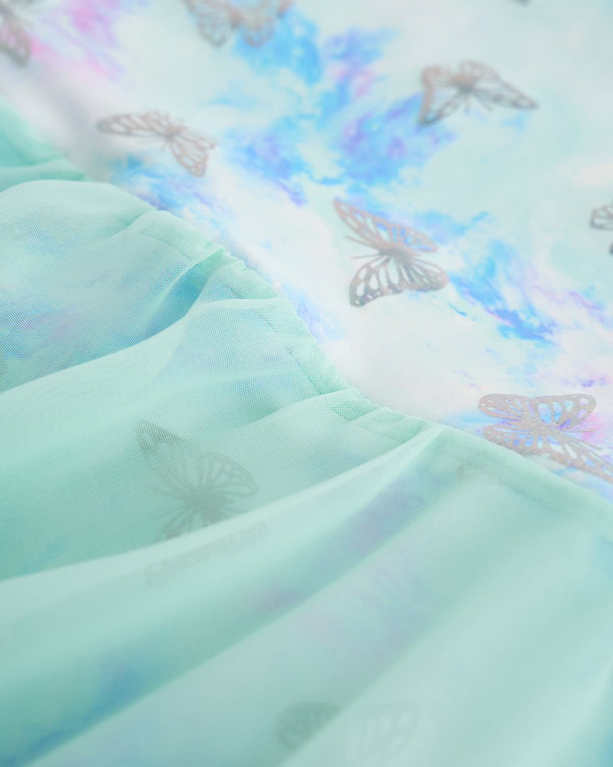 Close-up of Butterfly Mist ballerina ballet dress showing the shimmering print and lightweight layered skirt fabric.