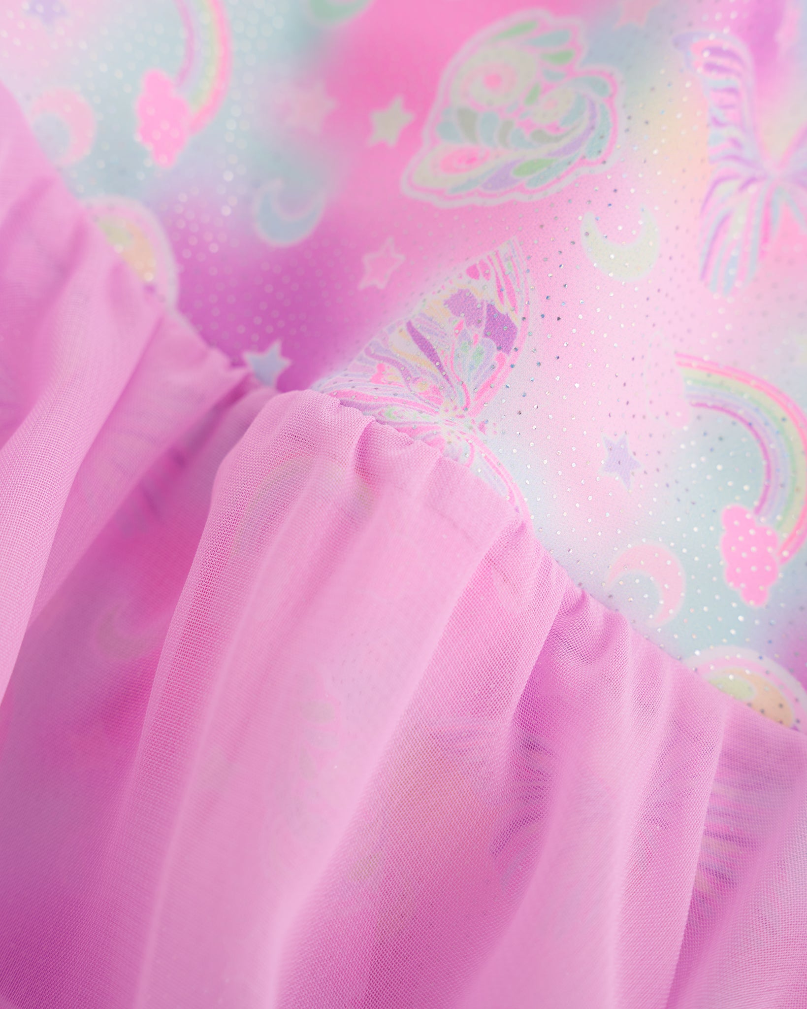 Close-up of Bow Dreams ballet dress showing the shimmering butterfly print and soft gathered lavender skirt fabric.