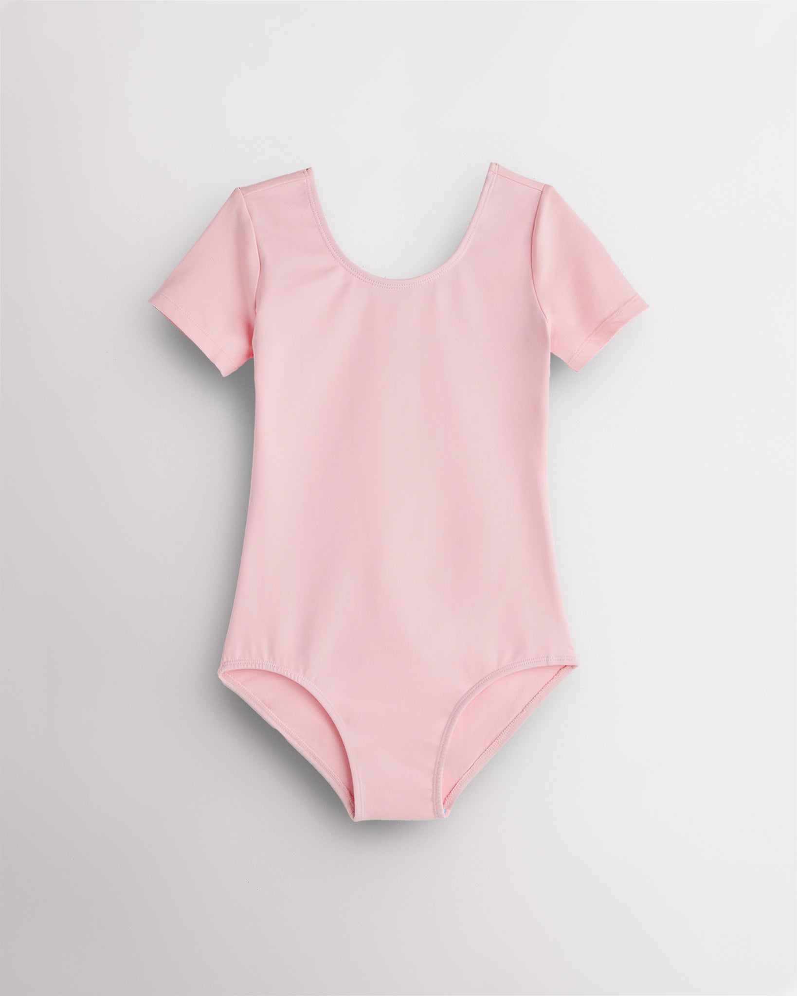 Ballet Pink leotard for girls with short sleeves, scoop neckline, and smooth performance fabric for ballet and dance.