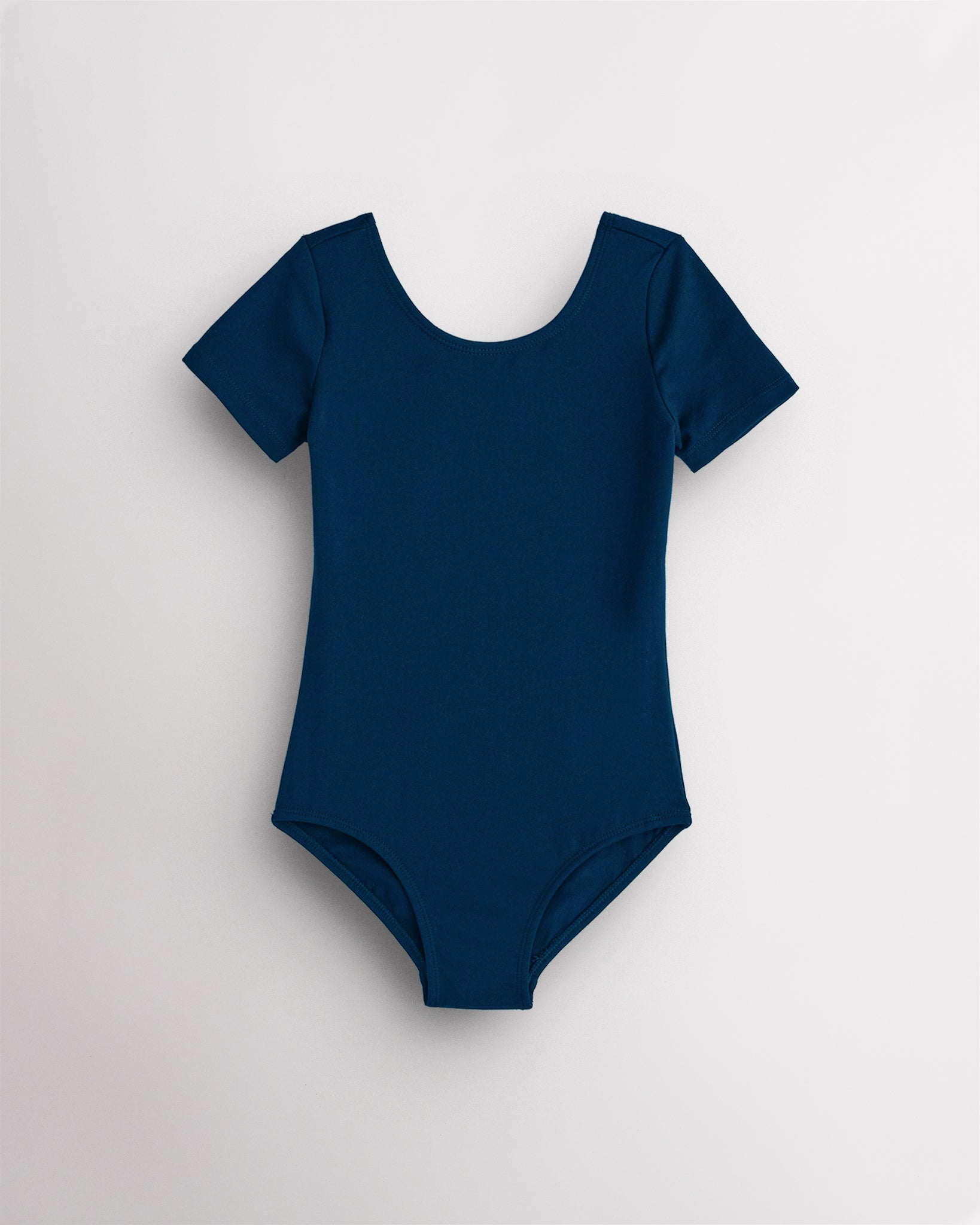 Navy leotard for girls with short sleeves, scoop neckline, and smooth performance fabric for ballet and dance.