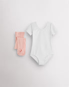 White short sleeve leotard with pink convertible dance tights laid flat for girls ballet and dance class.
