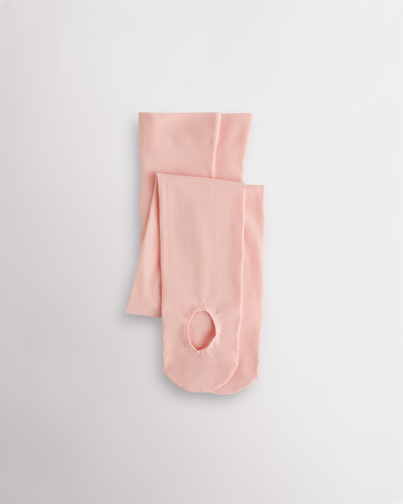 Pink convertible dance tights that can be worn as footed or footless tights for ballet and dance practice.