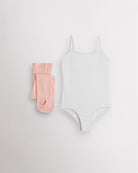 White girls camisole leotard with pink convertible dance tights laid flat for ballet and dance class.