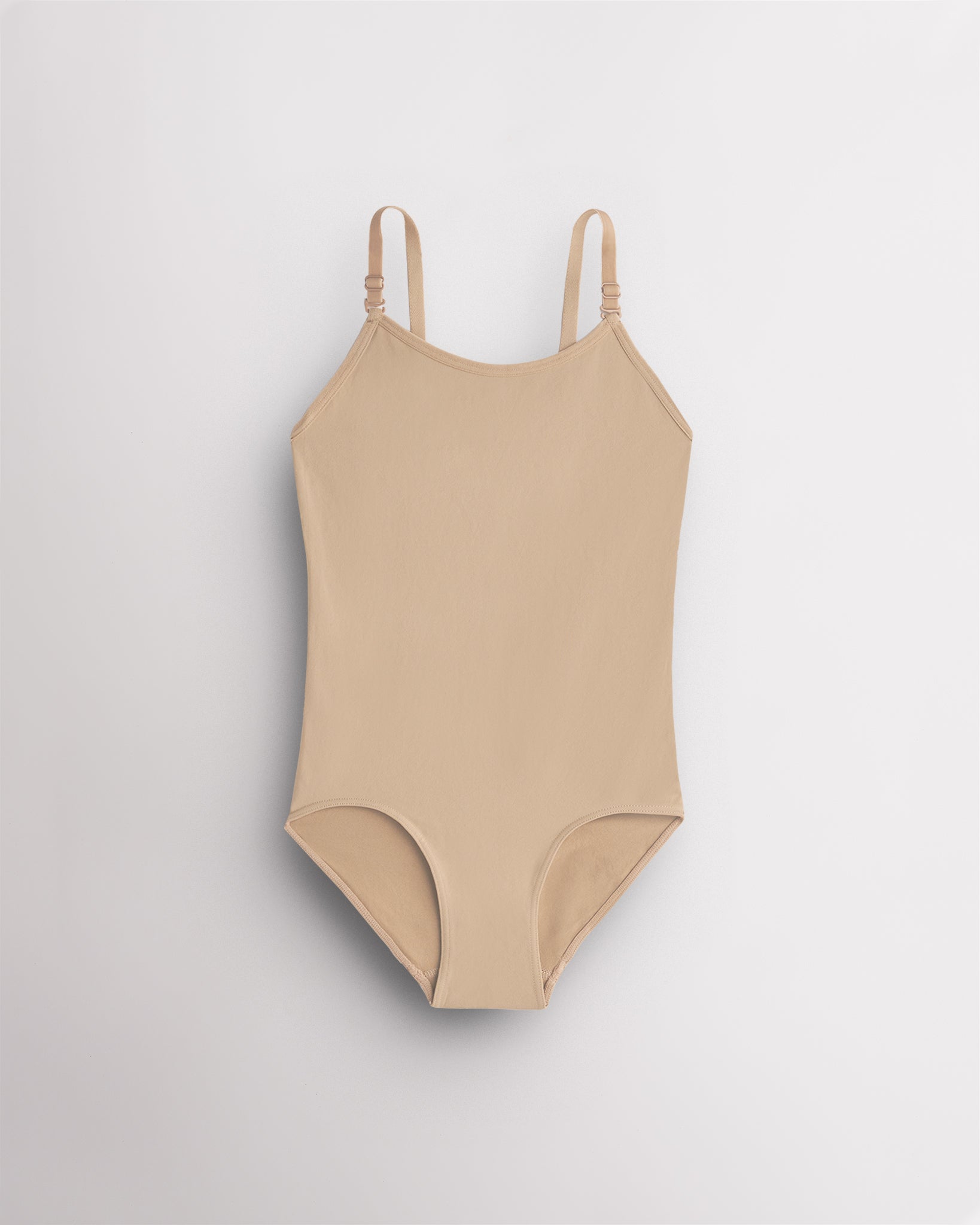 Rose Beige seamless camisole girls leotard with scoop neckline, adjustable straps, and smooth ballet base-layer design.