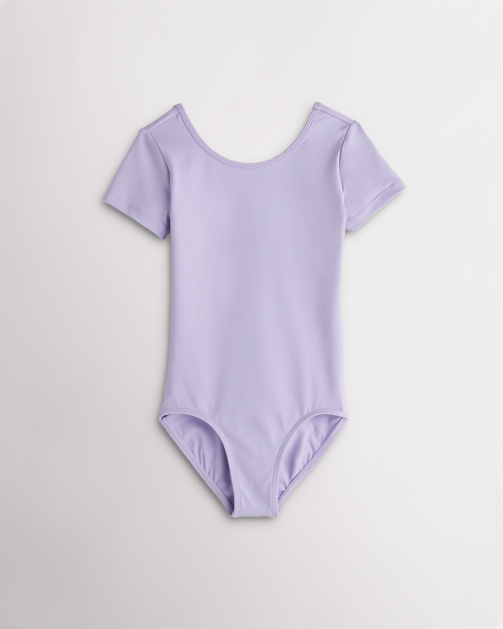 Girls lavender short sleeve leotard with scoop neckline and fitted stretch design for dance and ballet.