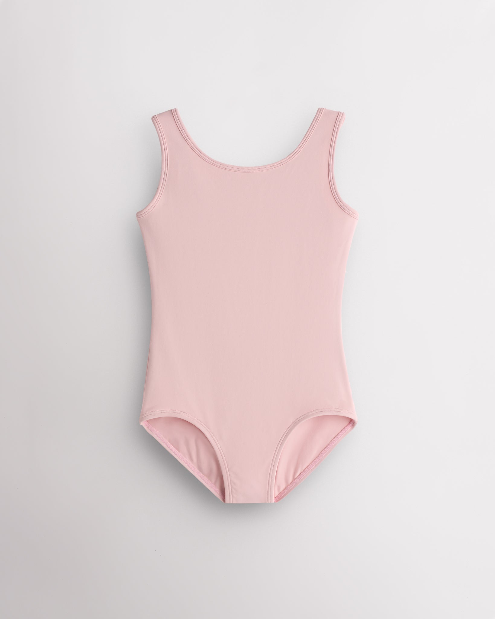 Girls pink sleeveless scoop neck ballet leotard with classic fitted design