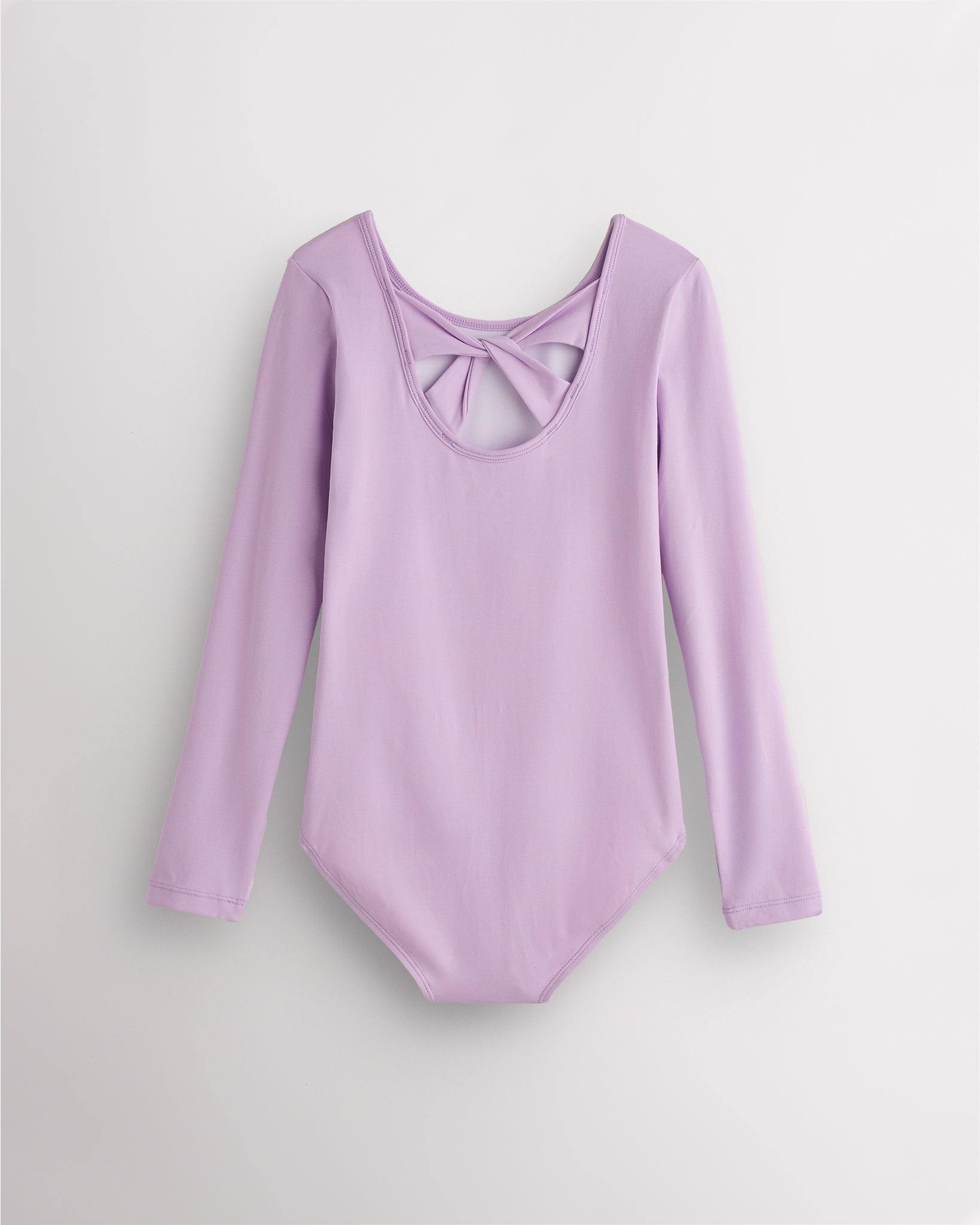 Back view of lavender long sleeve leotard for girls with twist-back bow detail and soft cotton fabric.