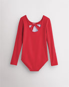 Back view of red long sleeve leotard for girls with twist-back bow detail and soft cotton fabric.