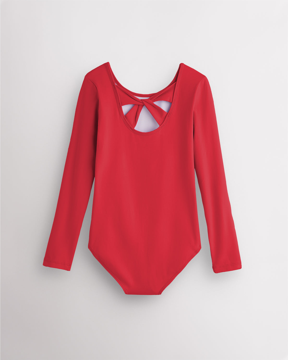 Back view of red long sleeve leotard for girls with twist-back bow detail and soft cotton fabric.