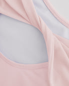 Close-up of Ballet Pink ballet leotard showing the sheer twisted mesh back fabric and smooth performance material.
