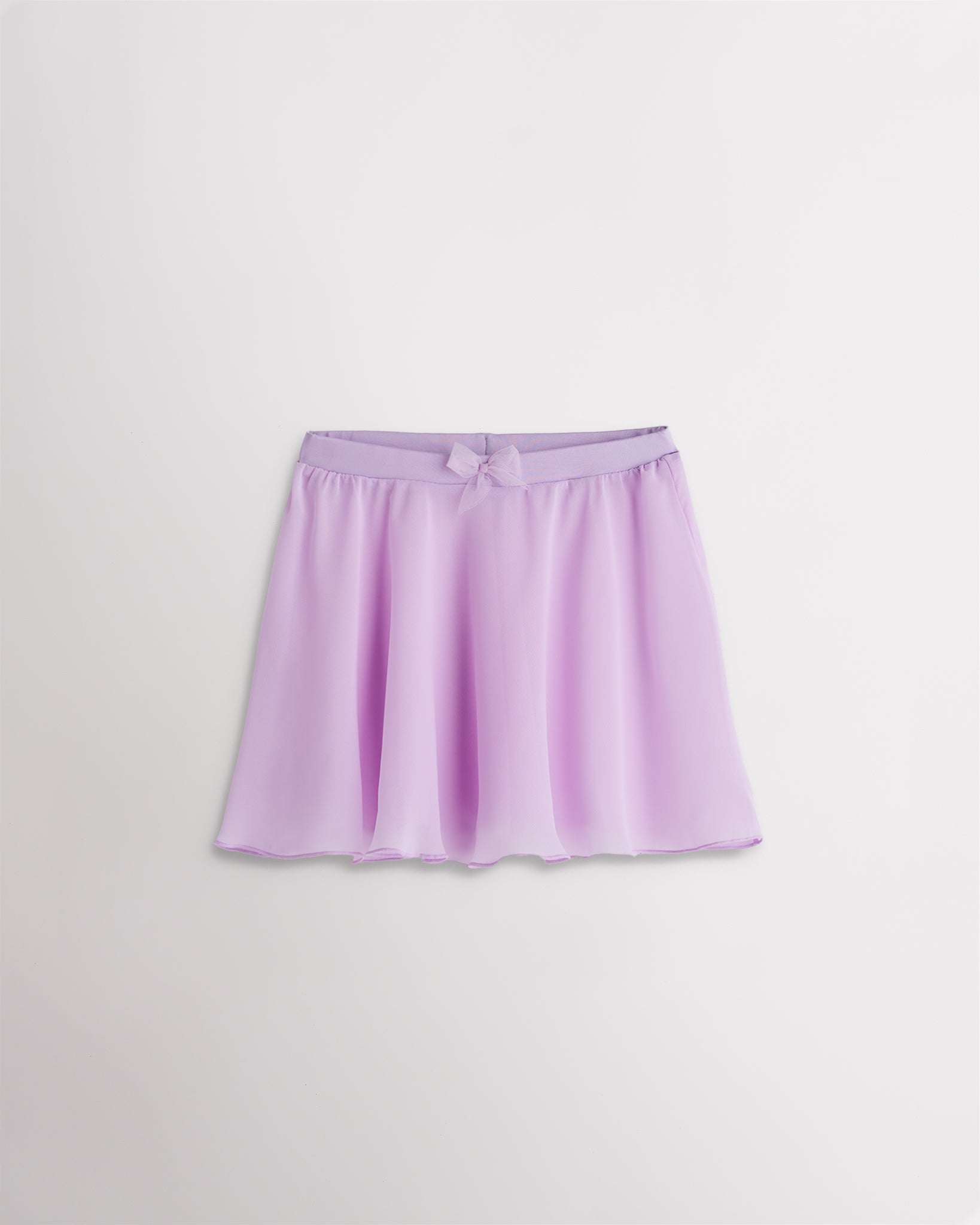 Girls lavender chiffon ballet dance skirt with a flowy silhouette, elastic waistband, and bow detail at the waist.