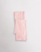 Pink girls microfiber footless dance tights folded flat with elastic waistband and soft fabric for ballet and dance practice.