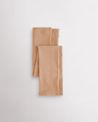 Light Tan girls microfiber footless dance tights folded flat with elastic waistband and soft fabric for ballet and dance practice.