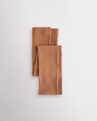 Warm Tan girls microfiber footless dance tights folded flat with elastic waistband and soft fabric for ballet and dance practice.
