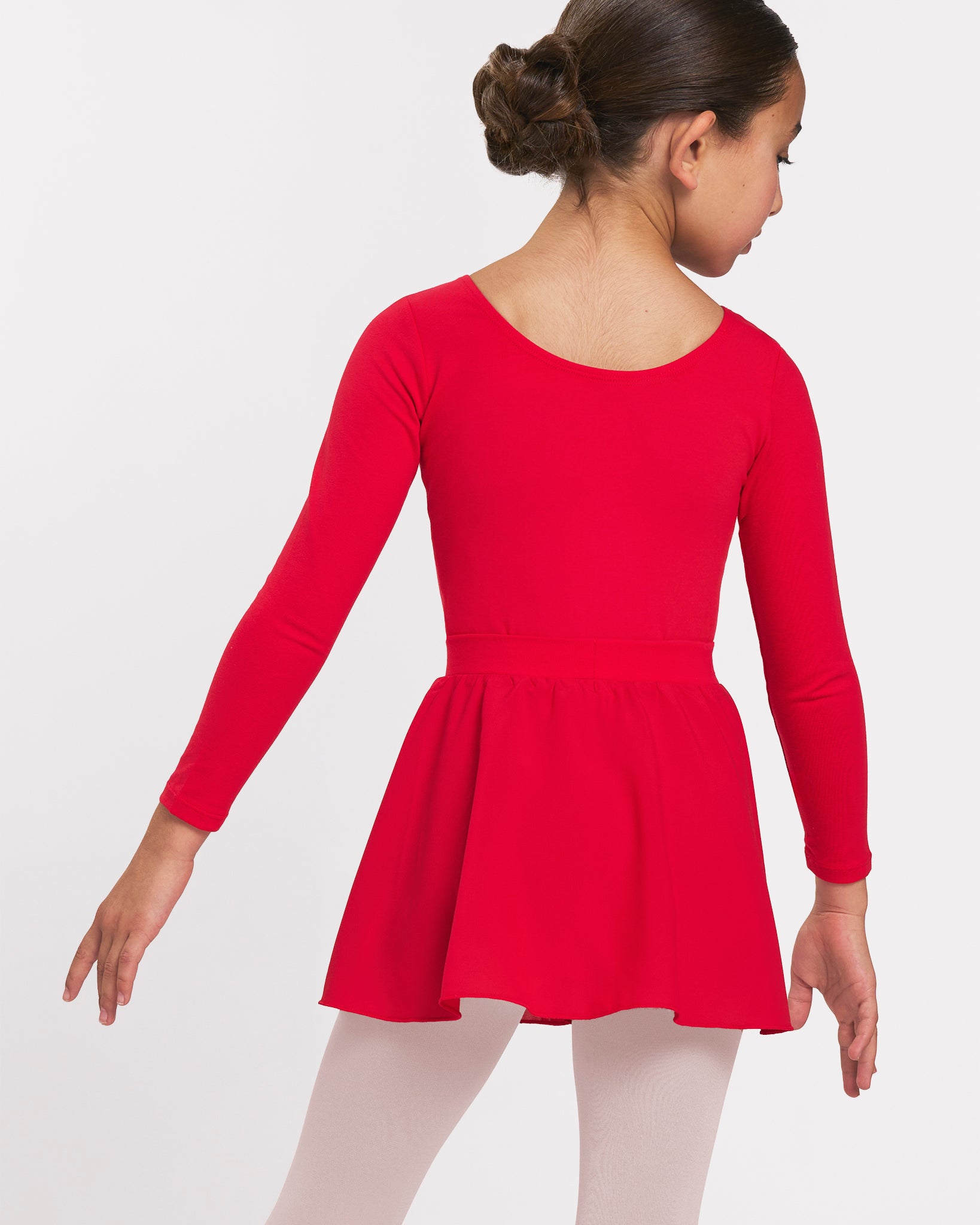 Back view of girl wearing a red long sleeve ballet leotard with matching pull-on skirt and ballet tights.