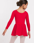 Back view of girl wearing a red long sleeve ballet leotard with matching pull-on skirt and ballet tights.