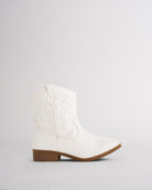 Kids white cowboy boot in a short western bootie style with tonal embroidery and a low heel, side view