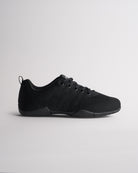 Black kids cheer shoes with knit upper and lace-up design, side profile view