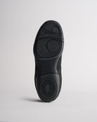 Bottom sole of kids cheer shoes showing grip pattern for traction and stability