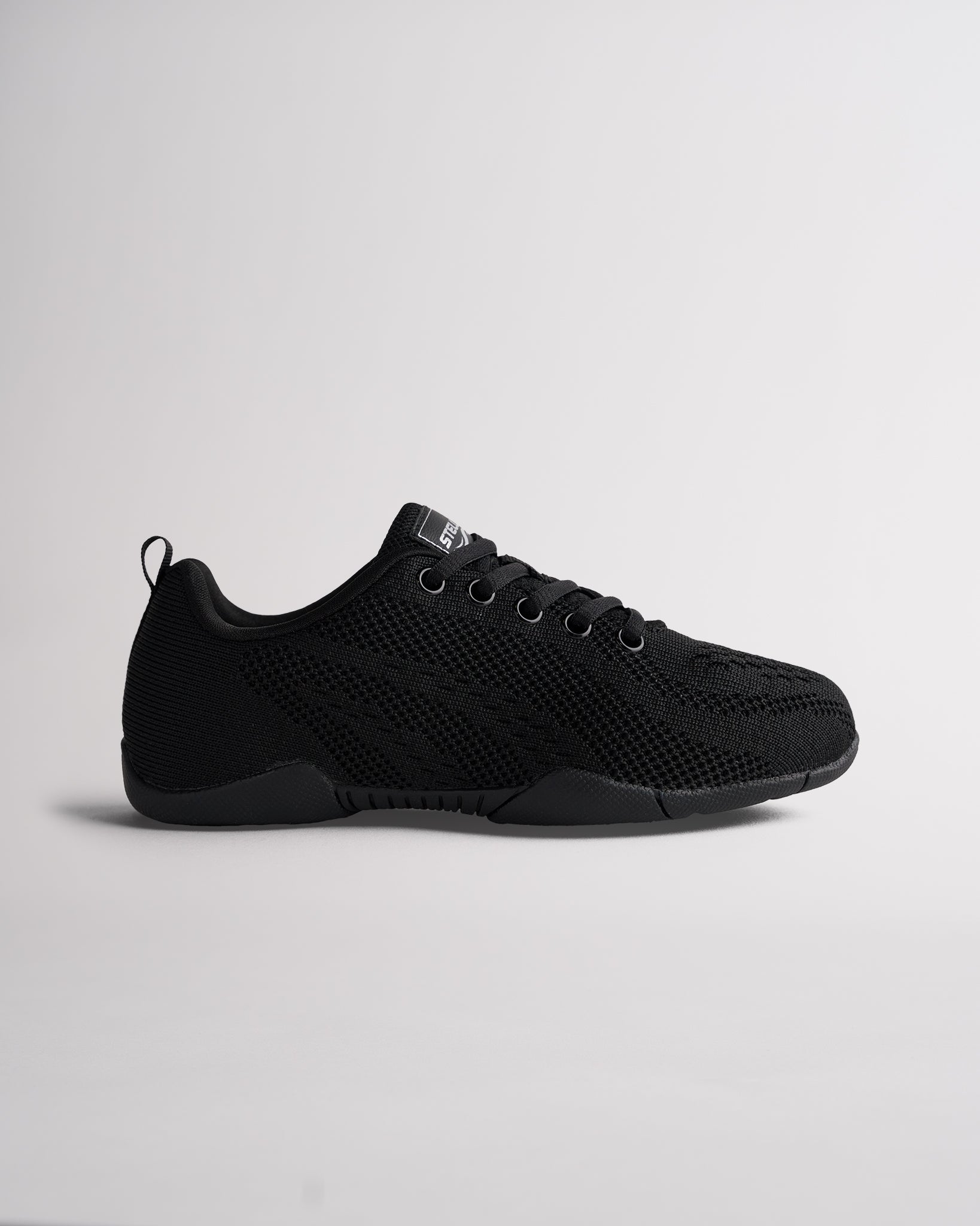 black kids cheer shoes with breathable knit upper and lace-up design, side view