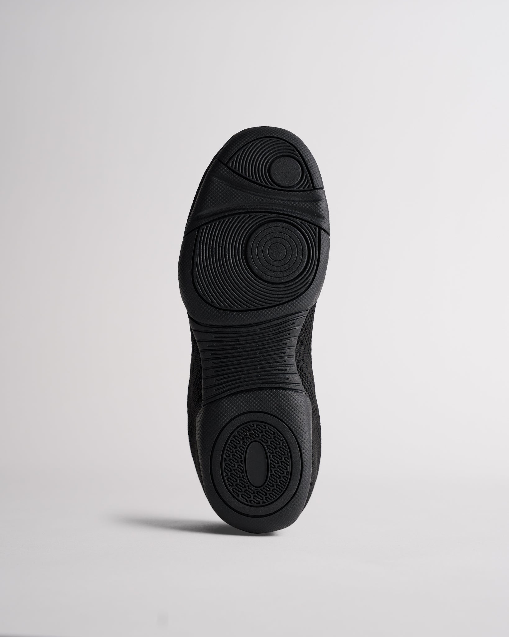 Bottom sole of kids cheer shoes showing traction pattern for grip and stability