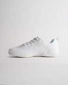 Angled view of white cheer shoes for girls showing flexible sole and textured knit