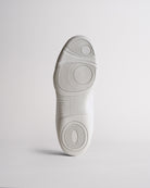 Bottom sole of kids cheer shoes showing traction pattern for grip and stability