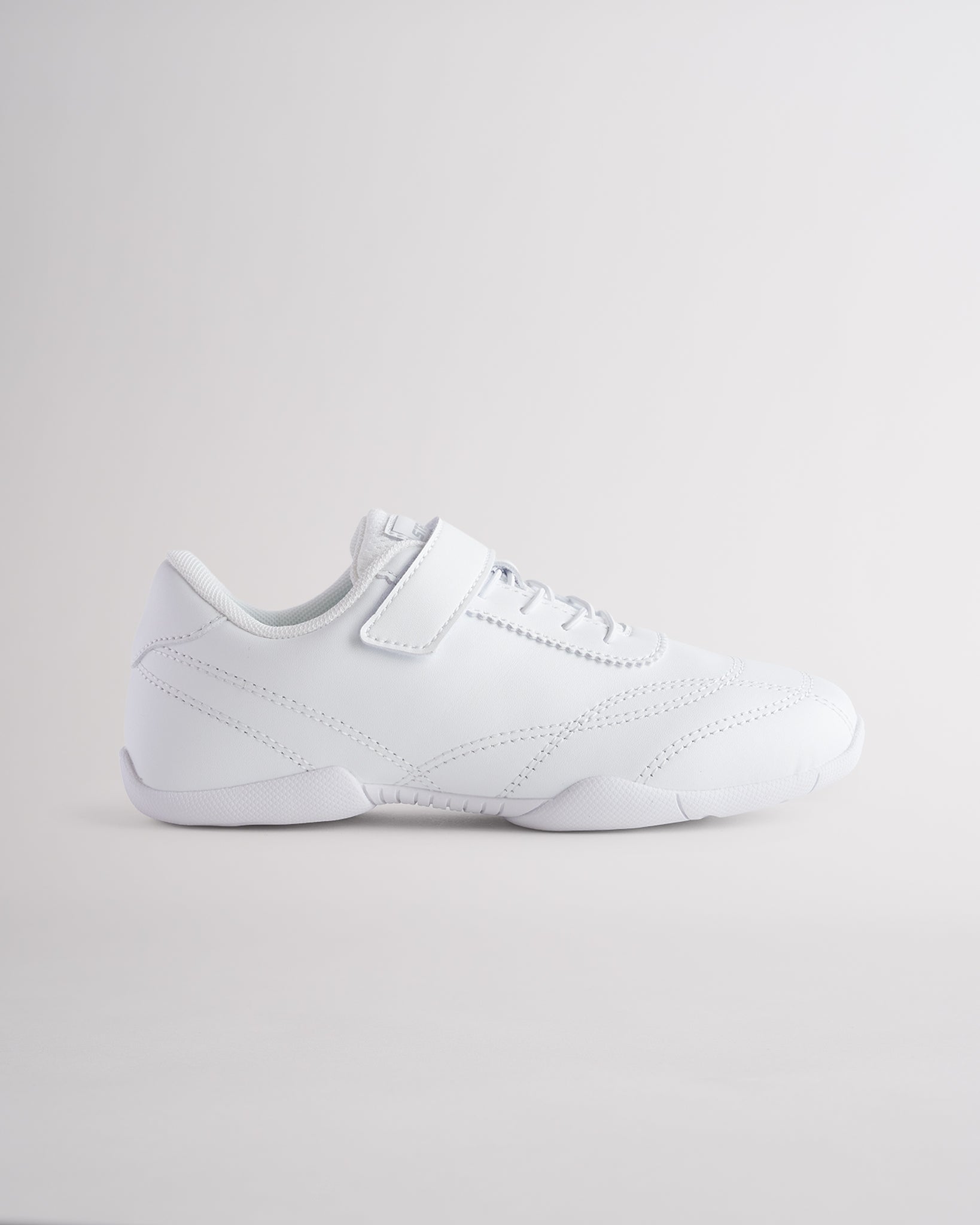 White cheer shoes for girls with hook and loop strap, lightweight supportive cheer shoes.