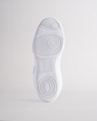 White cheer shoes outsole with textured grip pattern for stability and traction.