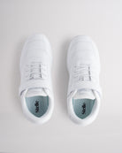 Top view of girls white cheer shoes with Velcro strap and lace design for secure fit.