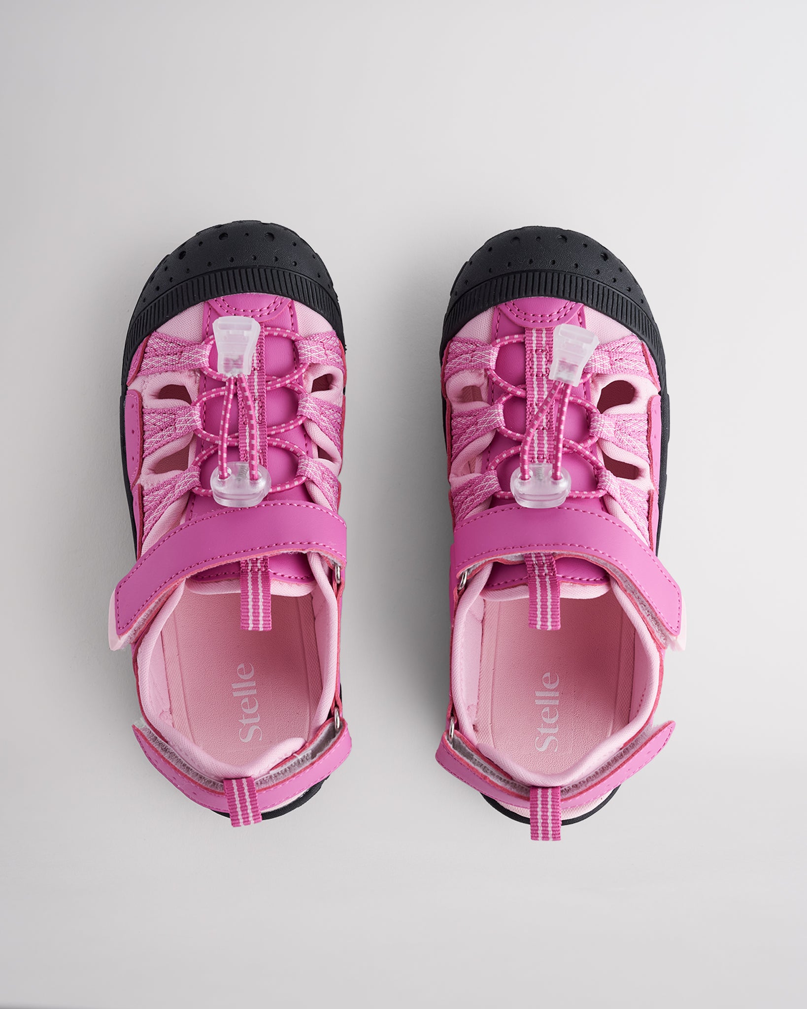 Top view of kids sandals with cord lace system and adjustable hook-and-loop straps for secure fit