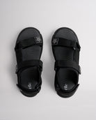 Top view of black sandals for kids with three adjustable straps and textured footbed