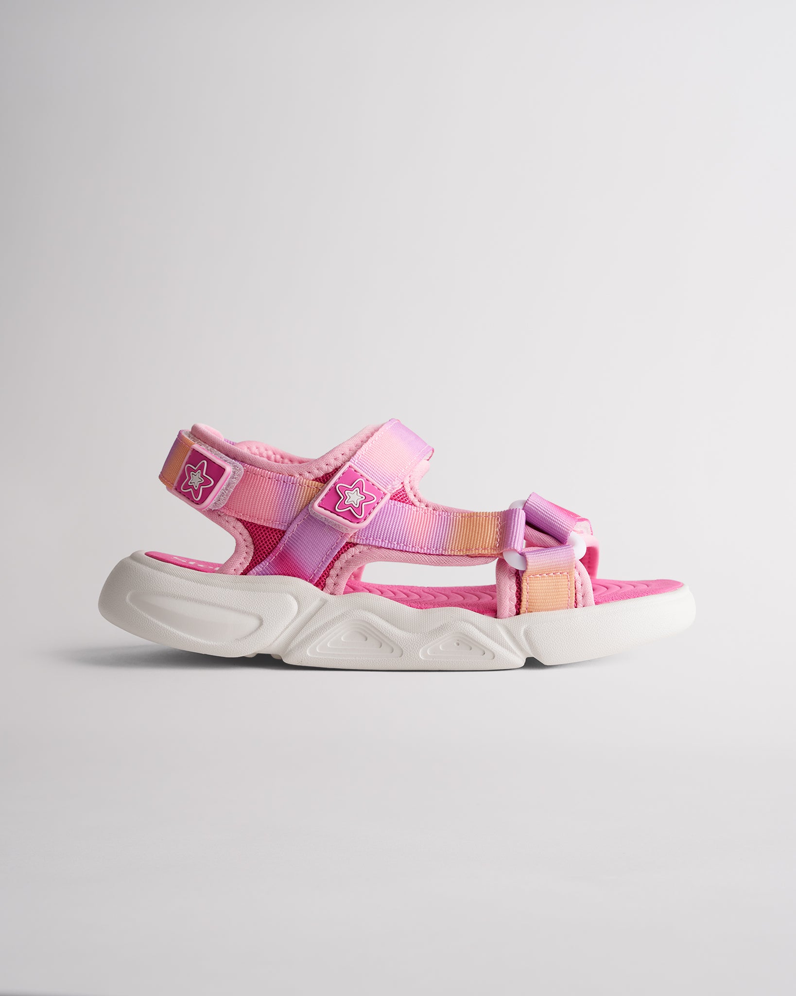 Fuchsia kids sandals with triple adjustable straps and lightweight cushioned sole