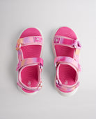 Top view of fuchsia sandals for kids with three adjustable straps and textured footbed